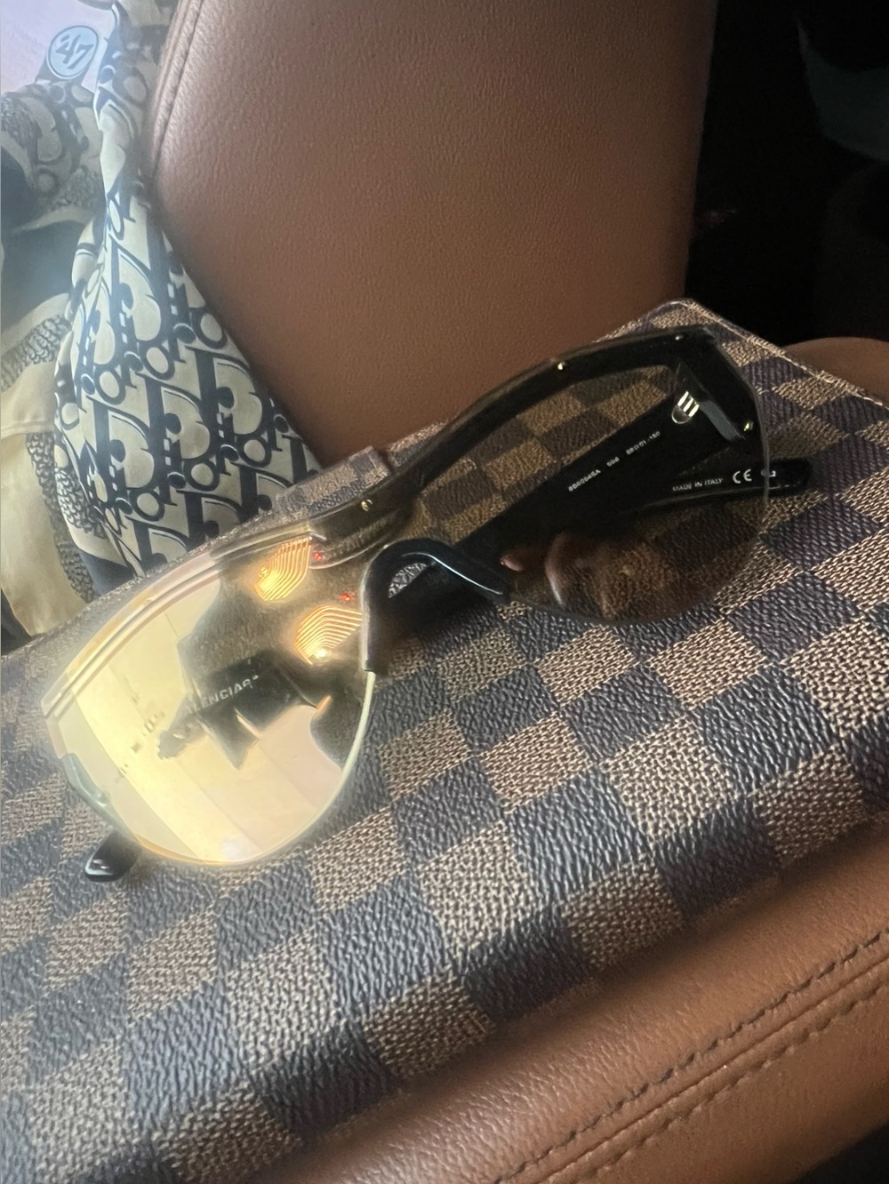 Balenciaga Men’s Black Frame Sunglasses with Gold-Tinted Lenses